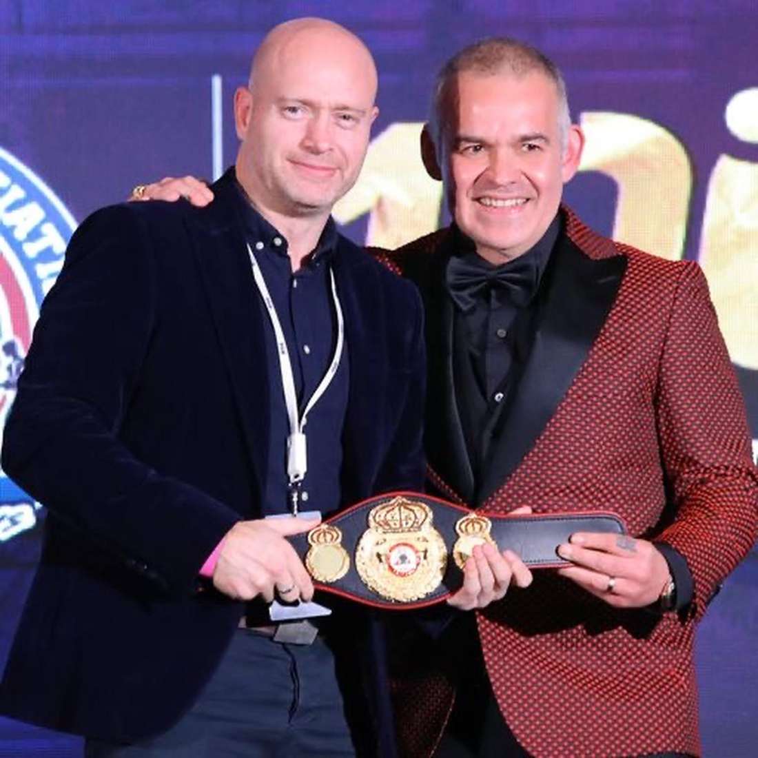 Patrick Killian with the championship belt and WBA President Gilberto Mendoza, 2022